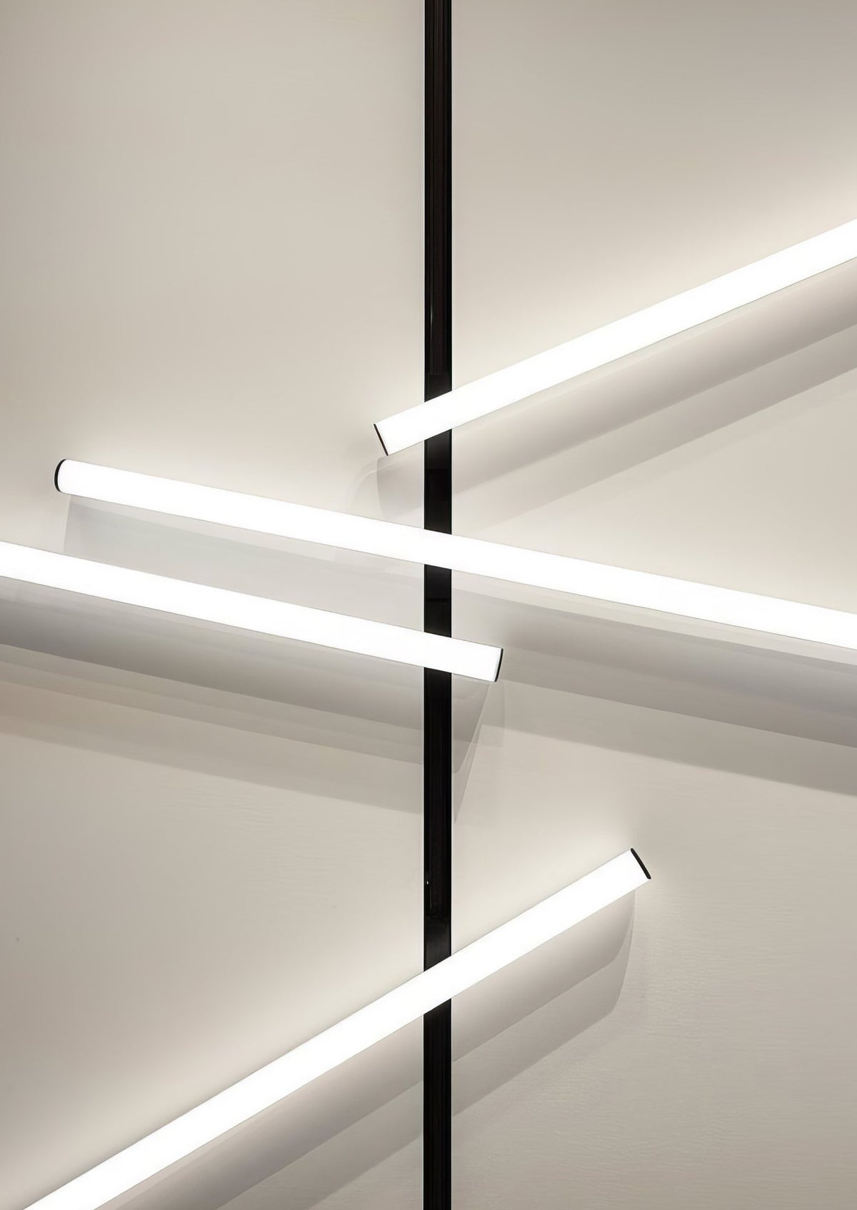 Linear lights crossing a black magnetic track on a wall