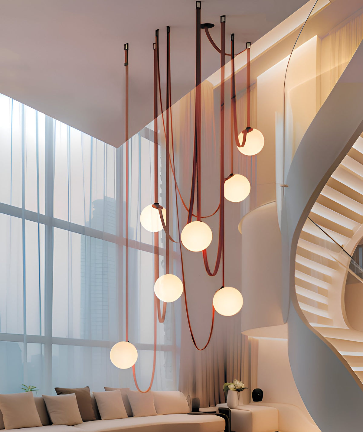 Belt system pendants in a double height living room