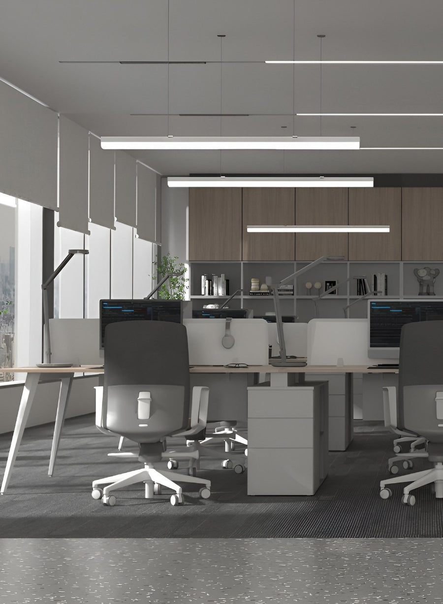 Suspended linear lights over office desks